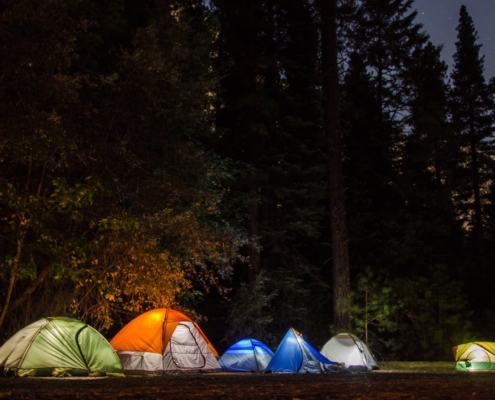 six camping tents in forest